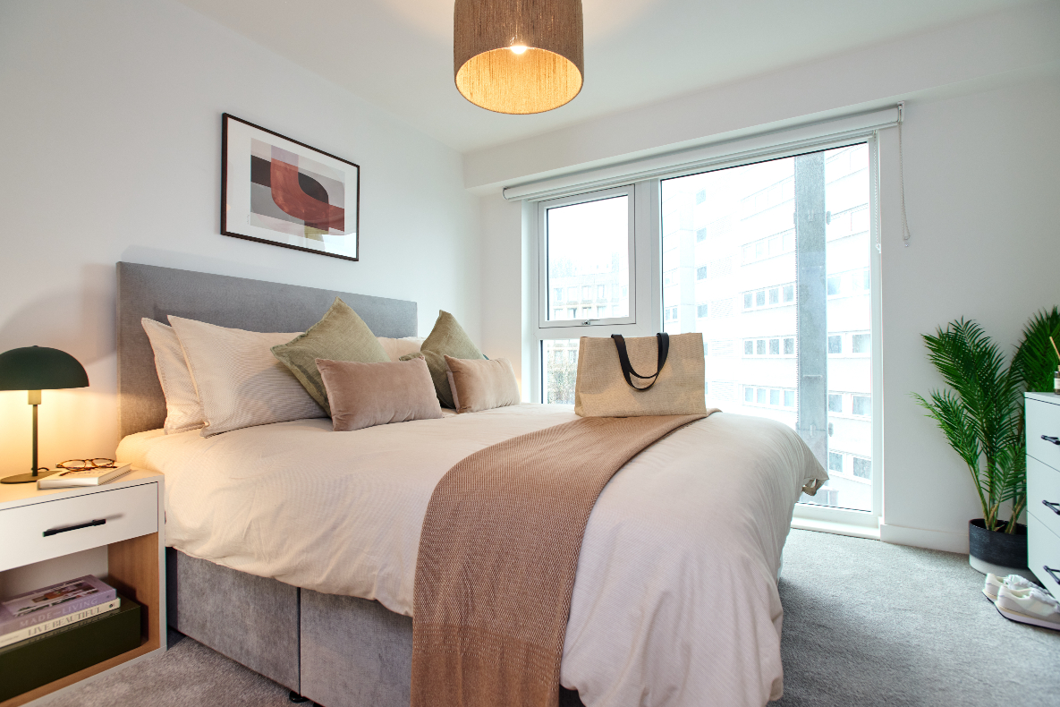 a double bed with fitted wardrobes