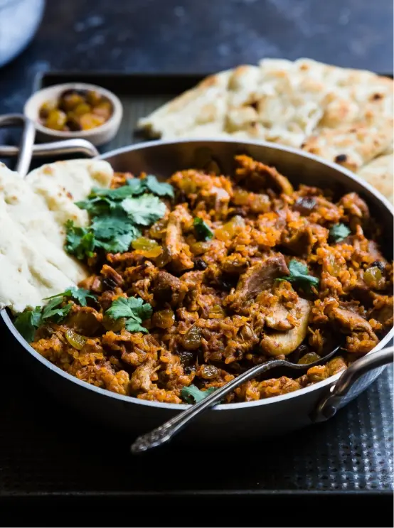 Mowgli Street Food in dish with naan bread to the side
